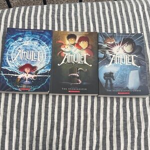 Scholastic Amulet Series - Blue, Red, and Gray Covers